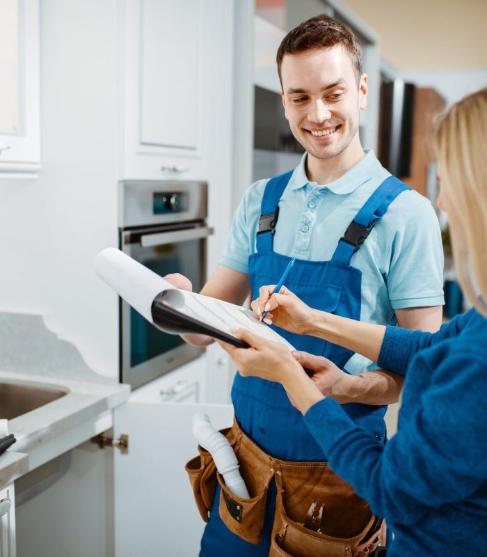 male-plumber-and-female-customer-in-the-kitchen.jpg